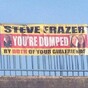 Cheating man dumped by both his girlfriends with one very public banner