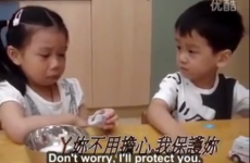 Little boy adorably comforts girl on their first day of school