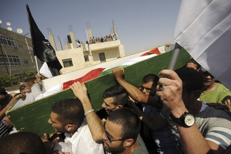 Palestinians carry the body of 16-year-old Mohammed Abu Khdeir in Jerusalem