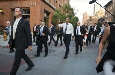 Barack Obama shakes hands with man wearing horse mask, fist bumps gorilla statue