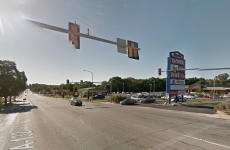 Body falls out of coroner's van and rolls into traffic