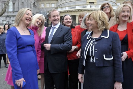 Taoiseach Enda Kenny surrounded by several female parliamentarians at Leinster House (File photo)