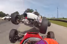Insane near-miss in a racecar doesn't even bother driver
