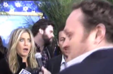 Super tall reporter scares the bejaysus out of Jen Aniston and Adam Sandler