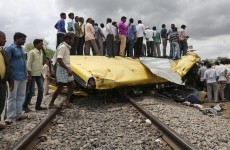 At least 19 dead after train crashes into school bus in India