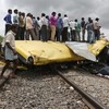 At least 19 dead after train crashes into school bus in India
