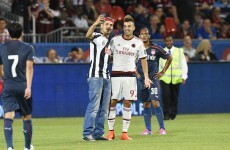 Pitch invader sinks to idiotic depths by posing for selfie with AC Milan star