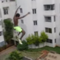 Guy jumps off five-storey building into swimming pool