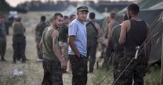 Ukraine negotiates return of soldiers 'forced to retreat' into Russia