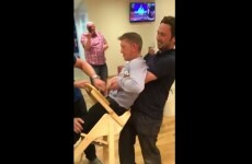 Grown man gets hilariously stuck in baby's high chair