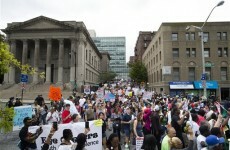 'We're here to deal with the rotten apples': Thousands rally over chokehold death in New York