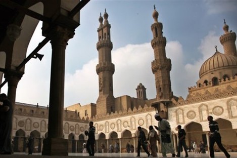 Muslims arrive to attend the Friday prayer at Al-Azhar mosque in Cairo, Egypt.