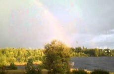 Rainbow admirer narrowly misses being hit by lightning