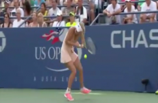 Caroline Wozniacki gets racket stuck in her ponytail during US Open match