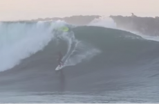 Hero surfer switches surfboards, MID-WAVE