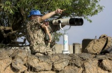 Syrian troops and Islamist rebels exchange fire near peace line in Golan Heights