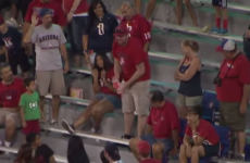 Mean guy at football game doesn't want anyone else to have fun, bursts beach ball