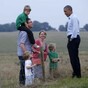 Barack Obama meets young family... in a field... in England