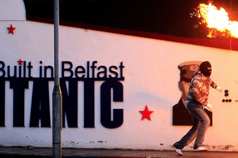 A rioter throws a petrol bomb towards the Nationalist Short Strand area of East Belfast last Tuesday night