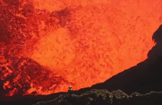 Dramatic video shows two men diving into an exploding volcano