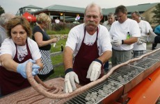 50 people actually volunteered to help grill a 100-foot long sausage