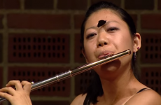 Butterfly lands on flautist's face mid-performance and she barely even blinks