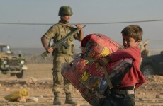 Pics: Thousands of terrified Kurds flee to Turkey to escape Islamic State