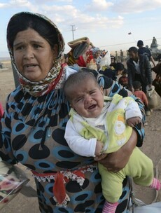 Fleeing ISIS: More than 130,000 Syrian Kurds have now crossed into Turkey
