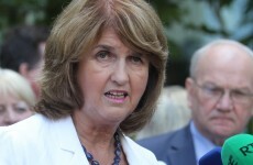 Protesters block Joan Burton's car from leaving Dublin event