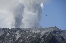 More than 30 feared dead in Japan as volcano continues to erupt