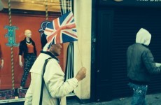 There's a guy leading a group of tourists up Grafton Street with a Union Jack