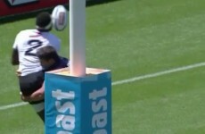Fiji player is way too cool about touching down, gets smashed