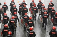 Police in Malaysia fire tear gas at protesters, arrest 1,667
