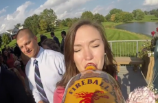 Camera attached to a bottle of booze passed around at a wedding