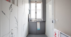 Check out the tiniest apartment in Paris - yes, that's the bed in the cupboard