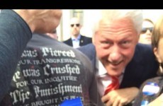 Bill Clinton photobombed a hilariously grumpy child and it was amazing