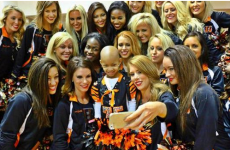 Opposing QBs embrace as Devon Still's ill daughter gets stadium ovation