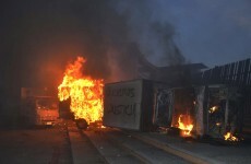 Mexican protesters set fire to palace door over student massacre