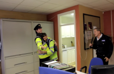 Why is Johnny Logan singing Hold Me Now in a Garda station?