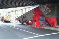 Lorry rear ripped off as it hits bridge