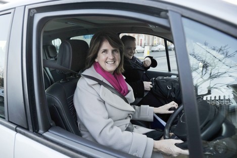 Joan Burton drives her own car to work in 2011.
