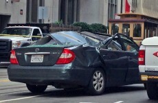 Window cleaner survives 11-story fall onto moving car