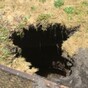 Woman swallowed by sinkhole while hanging out her washing