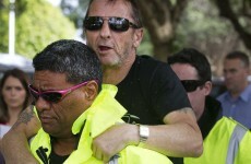 AC/DC drummer jumped on security guards and winked at reporters in court