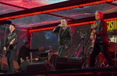 Chris Martin and Bruce Springsteen stood in for Bono and performed with U2 last night