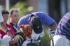 Tiger Woods stops to vomit on the first hole, makes birdie anyway