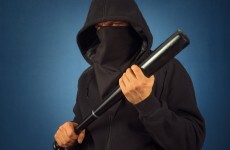 Man put in hospital after masked robbers armed with bats break into his house