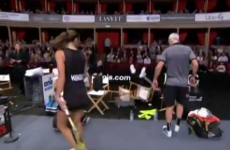 Elton John falling out of his chair at a tennis match