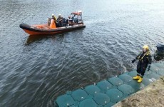 Four men on detached pontoon rescued from river