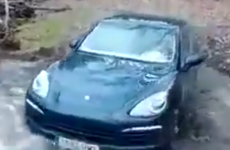 Guy attempts to drive a Porsche across a river, because why not?